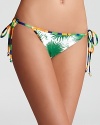 Flower power, in the form of an aster print, takes this string bikini bottom, set off by contrast trim, directly to sensational-by Milly.