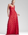 Take a prime position on the dance floor in Tadashi Shoji's Flamenco-inspired lace gown, rendered in a vibrant flame hue.