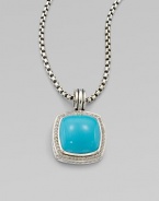 From the Albion Collection. Dazzling diamonds surround this smooth, domed turquoise stone set in sterling silver. TurquoiseDiamonds, .48 tcwSterling silverSize, about ½ Sterling silver baleImported Please note: Chain sold separately. 