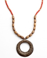 Full moon, full of potential. Strung with wooden beads and a hand-cut and hammered pendant, this Heart of Haiti necklace is crafted by a co-op that supports women's employment in local communities.