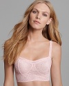 Rendered in sheer floral lace, Fashion Forms' whimsical bralette looks sweet peeking out from under tops. Style #P9647.