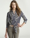 A unique spin on the classic button-up, this Velvet by Graham & Spencer top flaunts an eclectic print and a chic tie at the waist.