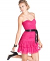 Prom or homecoming will always be memorable in this super-glam strapless dress by Hailey Logan! Fun ruching and ruffles show off your feminine side, while the black ribbon belt adds some edge to your look.