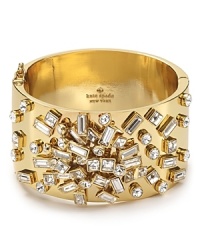 With true whimsical style from kate spade new york, this chunky gold-plated bangle traces the wrist in scattered glass stones.