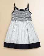 Crafted in plush cotton, this fancy frock's smocked bodice, full skirt and perky polka dots complete the look.Spaghetti strapsRound necklineButton backSmocked bodiceBack tie waistFull skirtFully linedCottonMachine wash coldImported Please note: Number of buttons may vary depending on size ordered. 