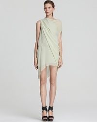 An ethereal Helmut Lang dress flaunts a Grecian-like aesthetic with lofty draped layers that float over your silhouette. Modern and feminine at the same time, this is a piece to own and adore.