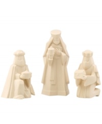 We three kings. The three wise men carrying their gifts of gold, frankincense and myrrh are portrayed in pure porcelain. From Lenox.