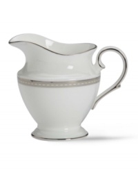 Metropolitan sensibility and modern design combine in this understated white bone china creamer from Lenox's collection of dinnerware and dishes. Platinum gild along the edge is enhanced by a clean, platinum geometric pattern reminiscent of architectural accents.