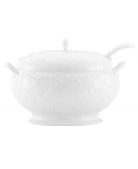 With an elegant white-on-white pattern featuring an embossed vine motif and radiant glaze, the Opal Innocence Carved soup tureen from Lenox gets your table set for refined dining every day. With ladle.