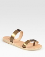 Soft leather footbed topped with glistening metallic leather straps and an unexpected toe ring. Metallic leather upperLeather lining and soleMade in GreeceOUR FIT MODEL RECOMMENDS ordering true whole size; ½ sizes should order the next whole size up. 