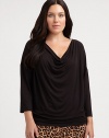 You will find this cowlneck top super flattering, thanks to its relaxed-yet-feminine fit and a hint of stretch. CowlneckThree-quarter sleevesPull-on styleAbout 29 from shoulder to hem95% rayon/5% spandexMachine washImported