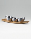 A trio of handcrafted metal bowls rest on a gently curved cherry wood base. 15 long Signature blue gift box Imported