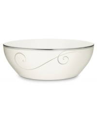 Fluid platinum scrolls glide freely throughout this beautiful fine china round vegetable bowl from Noritake. Easy to match with any decor, the fresh and elegant Platinum Wave collection of dinnerware and dishes is a timeless look for fine dining or luxurious everyday meals. Holds 96 oz.