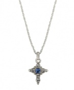 Symbolic style with a hint of color. Vatican pendant features an intricate cross decorated with round-cut clear crystals and a square-cut blue crystal center. Setting and chain crafted in silver tone mixed metal. Approximate length: 16 inches + 3-inch extender. Approximate drop: 1-1/4 inches.