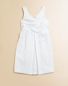 An angelic, eyelet frock with slight pleating in a crisp, clean hue is perfect for any special occasion.V-neckSleevelessHidden back zipperSlightly pleated skirtCottonMachine wash; dry flatImported