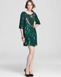 Detailed in shimmering pailettes, this Mark + James by Badgley Mischka dress brings in the season in a rich jewel-tone hue.