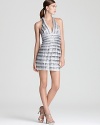 Tiers of sequins and satin lend a shimmering look to BCBGMAXAZRIA's showstopping halter dress.