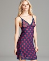 Sultry silhouette meets playful plaid print in this sheer chemise from Honeydew.