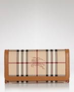 Burberry polishes off practical style with this billfold wallet. Crafted from durable cotton and ideally sized to tuck inside a purse, it's sure to keep your essentials in check.