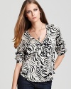 Revitalize your wardrobe with this silky-light Dolce Vita top enlivened with an on-trend zebra print.