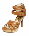 Strappy criss-cross details create sandals that are fresh and flirty! MICHAEL Michael Kors' Leona platform sandals take your style up a notch with a 4-1/2 stacked heel.