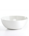 Keep it simple. In glossy white porcelain, this round vegetable bowl is a flawless accompaniment to any dinnerware pattern and decor. From Martha Stewart Collection.