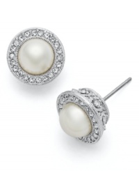 Frame your face with this signature style. Eliot Danori's elegant post stud earrings feature framed simulated pearls (7 mm) encircled by crystals and set in rhodium-plated mixed metal. Approximate diameter: 1/4 inch.