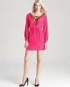 Metallic sequins mix with hot pink on this long-sleeved Trina Turk dress, cinched at the waist for a flattering fit.