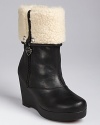 Cute boots may be our greatest consolation for the upcoming cold weather. KORS Michael Kors offers up a cute faux-suede and leather lace-up finished with a knit cuff at the top.