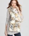 Plush and oversized, Rachel Zoe's snow leopard faux fur scarf travels glamorously from day to night.