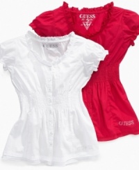 Top it off. This dainty smocked tunic from Guess is perfect for dressing up your little one for a sunny summer day.