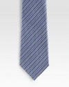 An elegant look handmade with diagonal stripes in fine Italian silk. Silk Dry clean Made in Italy 