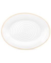 Distinctly ribbed Sophie Conran dinnerware sets your table with the charm of traditional hand-thrown pottery, but the durability of contemporary Portmeirion porcelain. Mix the banded Carnivale platter with solid biscuit pieces.