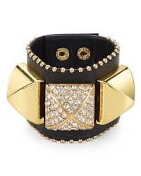 Punk-inspired style finds its pretty side with this edgy black leather cuff from Juicy Couture, which is detailed with gleaming pyramid studs.