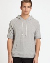 Sporty, hooded pullover perfect for casual weekend wear, in finely blended cotton knit for added warmth and comfort.Attached drawstring hoodFront kangaroo pockets95% cotton/5% polyurethaneMachine washImported