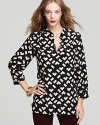 Fashion's most celebrated color duo mix it up on this striking silk Amanda Uprichard shirt in a unique chevron print.