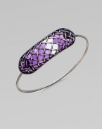 A bold, yet sleek style with a unique lattice pattern over glossy, colored glass. GlassSilverDiameter, about 2.5Hidden closureMade in Italy