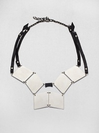 Like a work of modern sculpture, pewter-color triangular shapes and leather straps are worked into a visionary necklace that's anything but ordinary.Pewter-plated and hematite-plated brassLeatherLength, about 19 (adjustable)Lobster claspMade in USA