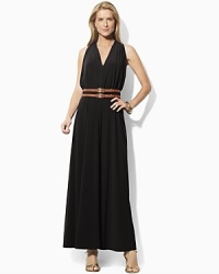 Crafted in sleek matte jersey, a flowing maxi dress is designed with a chic cutaway shoulder and belted waist for a figure-flattering look.