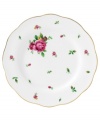 Revive a classic dinnerware pattern with the Vintage salad plate. Pretty pink and gold blossoms plucked from the Old Country Roses collection flower on white bone china with a ruffled gold edge.