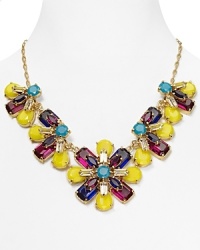 The floral motif makes an entrance on this kate spade new york bib necklace, which features a statement-making strand of colorful petals strung on a gold plated chain.