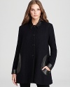 With a sculptural silhouette and slick leather trim, this RAOUL coat defines modern design. Slip it on for instant chic.