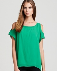 Breezy bare shoulders lend casual-chic to this silk-spun Alice + Olivia top--color your denim.