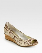 Divine snake print adds dimension to this leather wedge with high-tech cushioning and a natural cork wedge. Cork wedge, 1 (25mm)Snake-print leather upperLeather liningRubber solePadded insoleImported