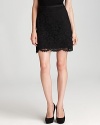 Lace scallops carefully the climb the length of this DKNY skirt for an effortlessly flirtatious feel. Contrast the short style with an oversized blazer for modern sophistication.