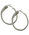 Sophistication reigns on these sparkling clutchless hoops from GUESS. Pave crystals adorn a classic earring silhouette. Crafted in silver tone mixed metal. Approximate drop: 2-1/4 inches.