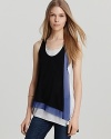 Adopt summer's style code with this BCBGMAXAZRIA color block tank, layered with a mesh lining and featuring a draped, asymmetric hem. Downtown cool for those haute summer days--this look steps up your style in one smart beat.