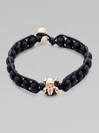 A modern array of black onyx beads are framed by leather detail and finished with a rose gold skull. OnyxLeatherRose goldLength, about 9Diameter, about 3 Clasp closureImported