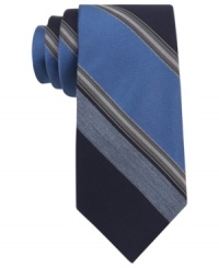 With a cool palette of colors, this Calvin Klein striped skinny tie makes a solid statement.