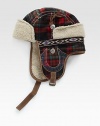 A winter essential, this trapper hat is crafted in a bold check pattern with signature horseshoe detail and trimmed with plush faux fur for long-lasting warmth.50% wool/50% polyesterDry cleanImported